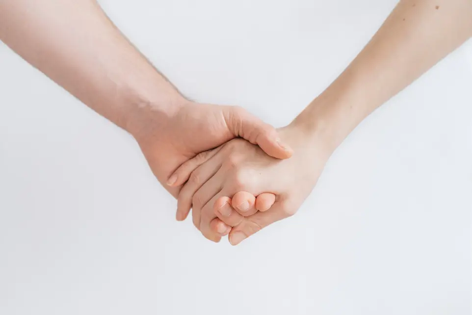 woman and man holding hands